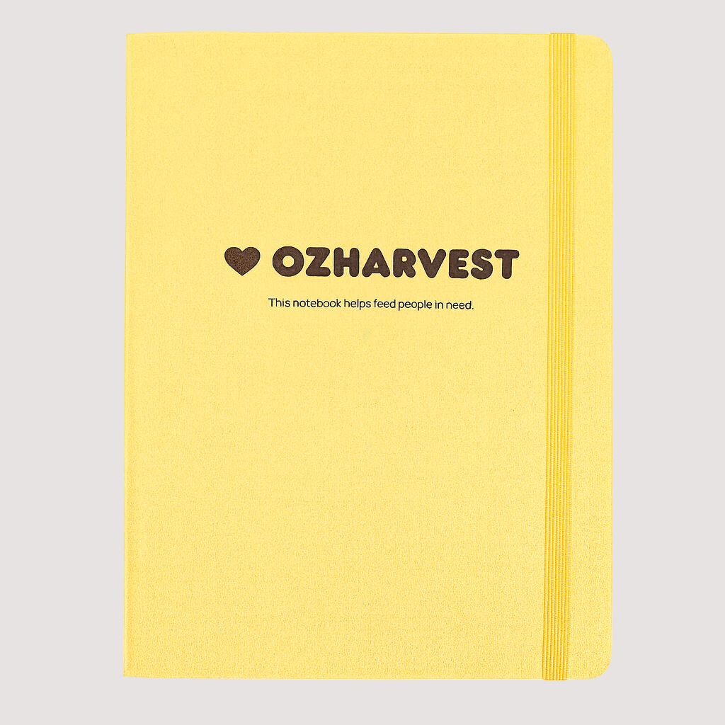Yellow notebook with OzHarvest branding on a white background