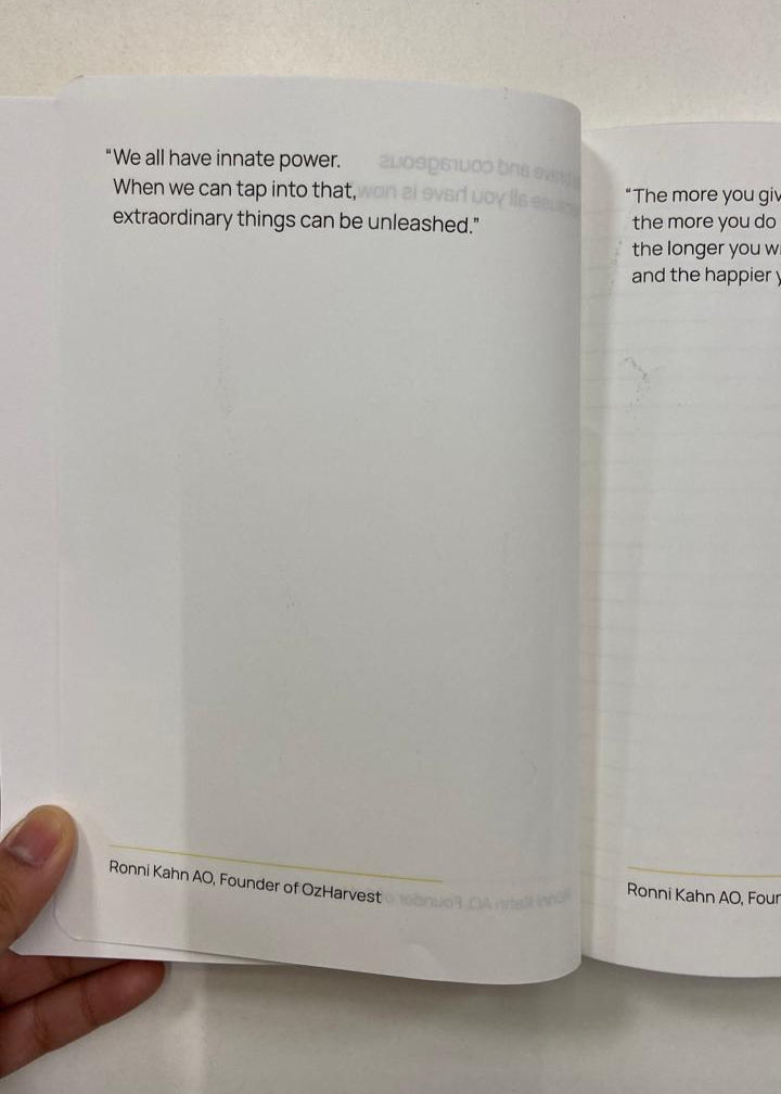 Open book with a quote on a white background