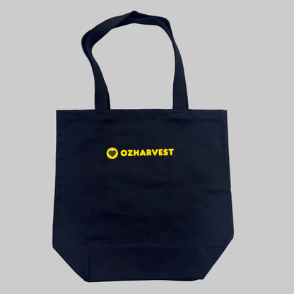 Black tote bag with yellow 'OzHarvest' logo 