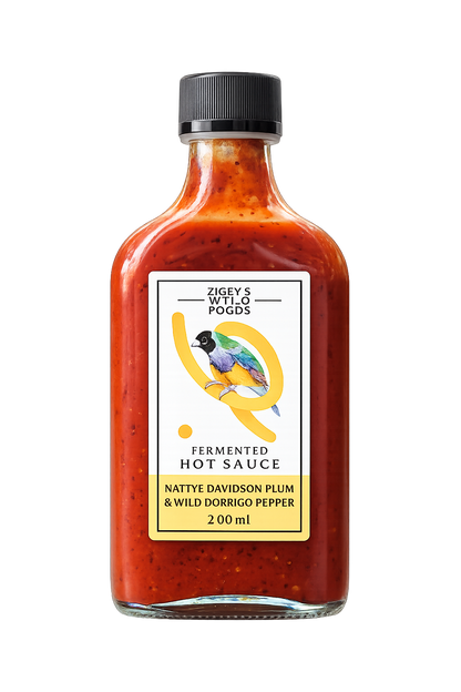 Bottle of fermented hot sauce with a label on a white background