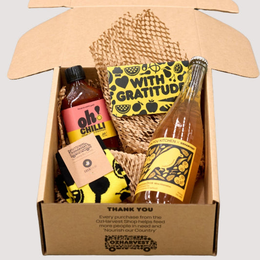 Gift set with bottles and a box in a cardboard packaging on a light gray background